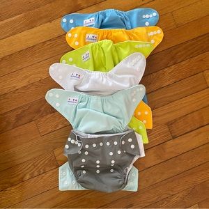 6 Cloth diaper covers + 8 inserts